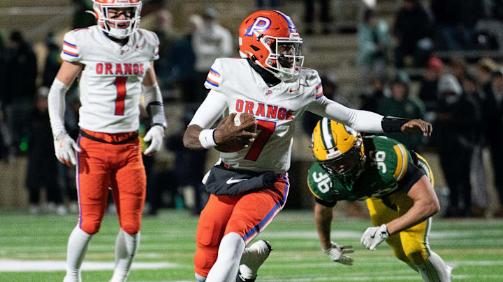 Olentangy Orange quarterback Levi Davis runs the ball in the Pioneers' 28-0 win over Lakewood St. Edward in the Division I state semifinal game Friday night, Nov. 28, 2025, at Arlin Field in Mansfield.