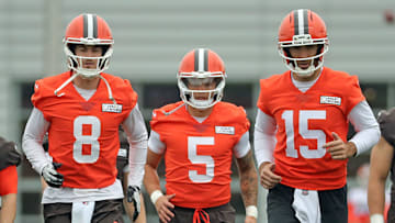 Cleveland Browns quarterbacks Kenny Pickett, left, Dillon Gabriel, center, and Joe Flacco warm up during an practice 