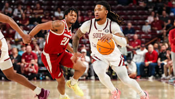 Mar 1, 2025; Columbia, South Carolina, USA; South Carolina Gamecocks guard Jamarii Thomas (6) drives past Arkansas Razorbacks guard D.J. Wagner (21) in the first half at Colonial Life Arena. Mandatory Credit: Jeff Blake-Imagn Images