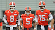 Cleveland Browns quarterbacks Kenny Pickett, left, Dillon Gabriel, center, and Joe Flacco warm up during a practice at the Browns training facility May 28, 2025, in Berea, Ohio.