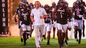 Sep 27, 2025; Columbia, South Carolina, USA; South Carolina Gamecocks head coach Shane Beamer leads his team onto the field during the Gamecocks 2001 entrance before their game against the Kentucky Wildcats at Williams-Brice Stadium. Mandatory Credit: Jeff Blake-Imagn Images