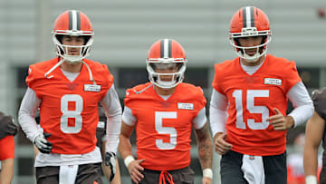 Cleveland Browns quarterbacks Kenny Pickett, left, Dillon Gabriel, center, and Joe Flacco warm up during an NFL practice at the Cleveland Browns training facility on Wednesday, May 28, 2025, in Berea, Ohio.