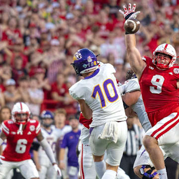 Nebraska defensive lineman Ty Robinson bats down a pass from Northern Iowa quarterback Aidan Dunne.