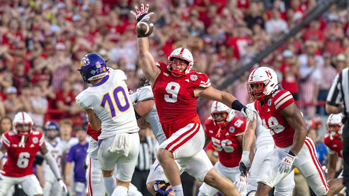 Nebraska defensive lineman Ty Robinson bats down a pass from Northern Iowa quarterback Aidan Dunne.