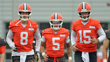 Cleveland Browns quarterbacks Kenny Pickett, left, Dillon Gabriel, center, and Joe Flacco warm up during an NFL practice at the Cleveland Browns training facility on Wednesday, May 28, 2025, in Berea, Ohio.