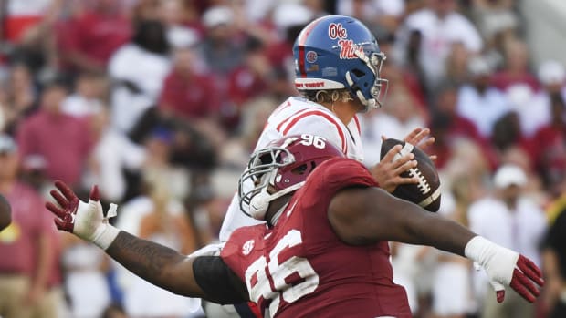 Alabama defensive lineman applies pressure during a game