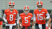 Cleveland Browns quarterbacks Kenny Pickett, left, Dillon Gabriel, center, and Joe Flacco warm up during an practice at the Browns training facility May 28, 2025, in Berea, Ohio.