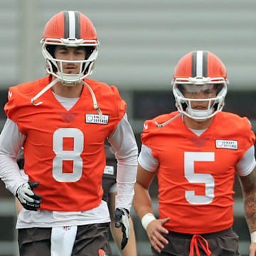 Cleveland Browns quarterbacks Kenny Pickett, left, Dillon Gabriel, center, and Joe Flacco warm up during an practice at the Browns training facility May 28, 2025, in Berea, Ohio.