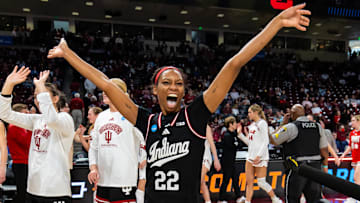 Indiana Hoosiers guard Chloe Moore-McNeil (22) celebrates with teammates following their 76-68 win over the Utah Utes at Colonial Life Arena.
