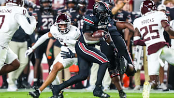 Nov 2, 2024; Columbia, South Carolina, USA; South Carolina Gamecocks running back Raheim Sanders (5) rushes against the Texas A&M Aggies in the first quarter at Williams-Brice Stadium. Mandatory Credit: Jeff Blake-Imagn Images