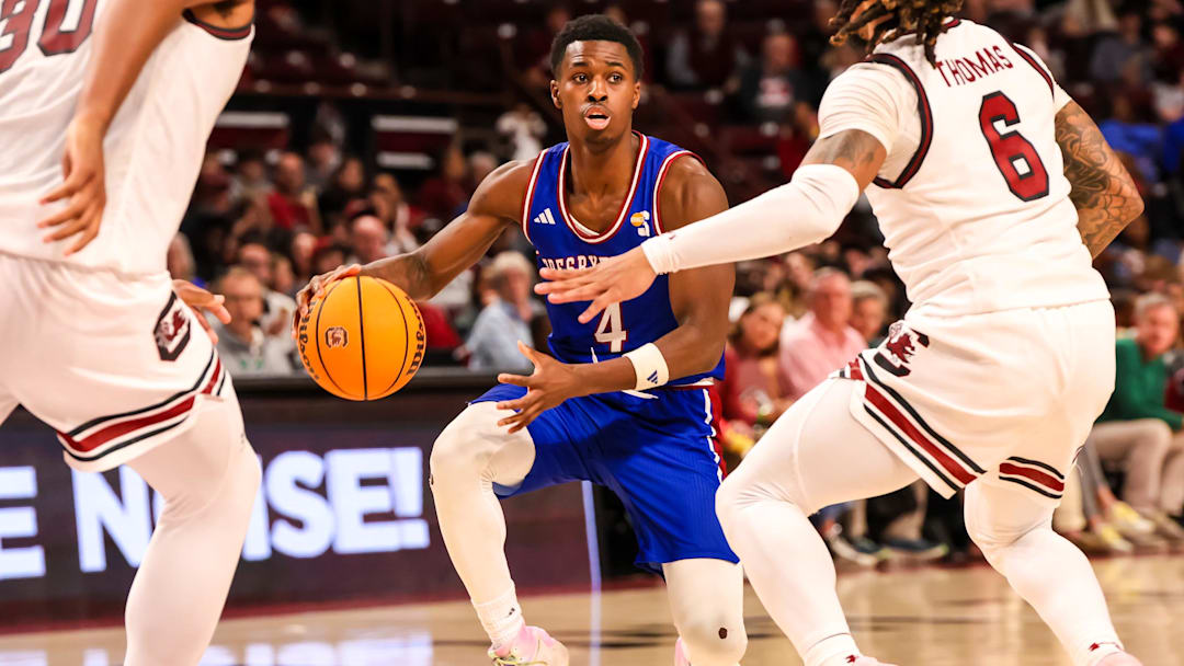 Dec 30, 2024; Columbia, South Carolina, USA; Presbyterian Blue Hose guard Kory Mincy (4) drives against the South Carolina Gamecocks in the second half at Colonial Life Arena. Mandatory Credit: Jeff Blake-Imagn Images