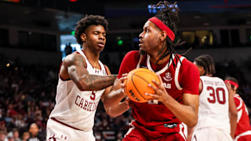 Mar 1, 2025; Columbia, South Carolina, USA; Arkansas Razorbacks forward Jonas Aidoo (9) looks to shoot over South Carolina Gamecocks forward Nick Pringle (5) in the second half at Colonial Life Arena. Mandatory Credit: Jeff Blake-Imagn Images