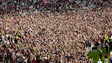 Nov 2, 2024; Columbia, South Carolina, USA; South Carolina Gamecocks students rush the field following their win over the Texas A&M Aggies at Williams-Brice Stadium. Mandatory Credit: Jeff Blake-Imagn Images