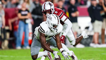 Sep 23, 2023; Columbia, South Carolina, USA; Mississippi State Bulldogs wide receiver Jordan Mosley (18) drops a pass as South Carolina Gamecocks defensive back Emory Floyd Jr. (8) defends in the second half at Williams-Brice Stadium. Mandatory Credit: Jeff Blake-Imagn Images
