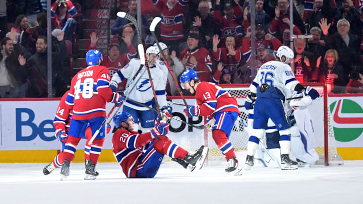Apr 9, 2026; Montreal, Quebec, CAN; Montreal Canadiens forward Juraj Slafkovsky (20) celebrates with teammates including forward Cole Caufield (13) after scoring a goal against the Tampa Bay Lightning during the third period at the Bell Centre. Mandatory Credit: Eric Bolte-Imagn Images