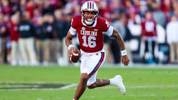 Nov 23, 2024; Columbia, South Carolina, USA; South Carolina Gamecocks quarterback LaNorris Sellers (16) scrambles against the Wofford Terriers in the first quarter at Williams-Brice Stadium. Mandatory Credit: Jeff Blake-Imagn Images