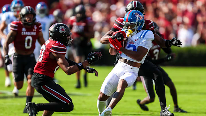 Oct 5, 2024; Columbia, South Carolina, USA; Mississippi Rebels wide receiver Antwane Wells Jr. (3) attempts to get past South Carolina Gamecocks defensive back Judge Collier (20) and defensive back Nick Emmanwori (7) in the first quarter at Williams-Brice Stadium. Mandatory Credit: Jeff Blake-Imagn Images