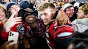 Nov 19, 2022; Columbia, South Carolina, USA; South Carolina Gamecocks linebacker Colin Bryant (45) celebrates with students on the field after defeating the Tennessee Volunteers at Williams-Brice Stadium. Mandatory Credit: Jeff Blake-Imagn Images