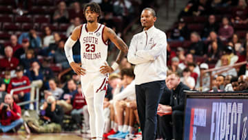 Dec 7, 2024; Columbia, South Carolina, USA; South Carolina Gamecocks head coach Lamont Paris speaks with South Carolina Gamecocks guard Cam Scott (23) against the East Carolina Pirates in the second half at Colonial Life Arena. Mandatory Credit: Jeff Blake-Imagn Images