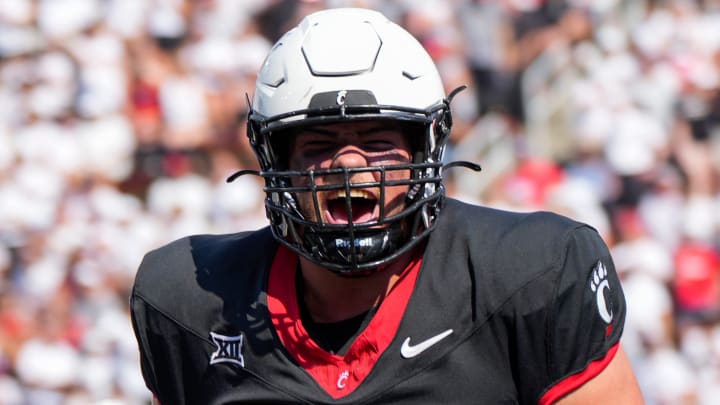 Cincinnati Bearcats offensive lineman Luke Kandra (67) celebrates after Cincinnati Bearcats tight end Payten Singletary (88) scores a touchdown during the first half of the NCAA football game between the Cincinnati Bearcats and the Eastern Kentucky Colonels at Nippert Stadium in Cincinnati on Saturday, Sept. 2, 2023. Cincinnati Bearcats offensive lineman Luke Kandra (67) celebrates after Cincinnati Bearcats tight end Payten Singletary (88) scores a touchdown during the first half of the NCAA football game between the Cincinnati Bearcats and the Eastern Kentucky Colonels at Nippert Stadium in Cincinnati on Saturday, Sept. 2, 2023.