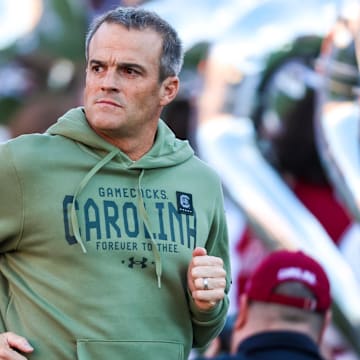 Nov 23, 2024; Columbia, South Carolina, USA; South Carolina Gamecocks head coach Shane Beamer takes the field with his team before a game against the Wofford Terriers at Williams-Brice Stadium. Mandatory Credit: Jeff Blake-Imagn Images