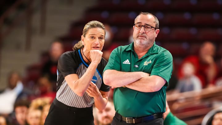 Mar 18, 2022; Columbia, South Carolina, USA; South Florida Bulls head coach Jose Fernandez disputes a call against the Miami Hurricanes in the second quarter at Colonial Life Arena. Mandatory Credit: Jeff Blake-Imagn Images Mar 18, 2022; Columbia, South Carolina, USA; South Florida Bulls head coach Jose Fernandez disputes a call against the Miami Hurricanes in the second quarter at Colonial Life Arena. Mandatory Credit: Jeff Blake-Imagn Images