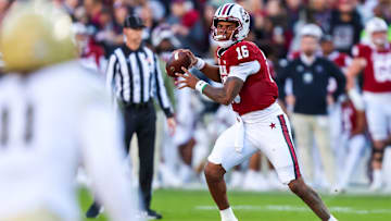 Nov 23, 2024; Columbia, South Carolina, USA; South Carolina Gamecocks quarterback LaNorris Sellers (16) rolls out to pass against the Wofford Terriers in the first quarter at Williams-Brice Stadium. Mandatory Credit: Jeff Blake-Imagn Images