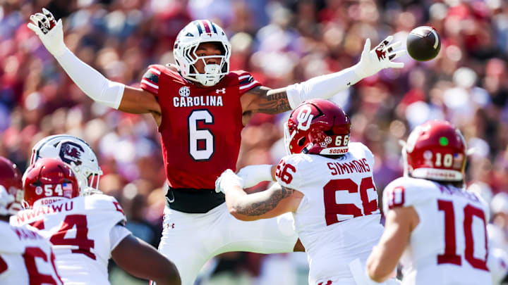 Oct 18, 2025; Columbia, South Carolina, USA; South Carolina Gamecocks defensive end Dylan Stewart (6) attempt to knock down a pass by Oklahoma Sooners quarterback John Mateer (10) in the first quarter at Williams-Brice Stadium. Mandatory Credit: Jeff Blake-Imagn Images