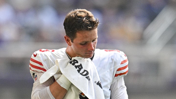 Sep 15, 2024; Minneapolis, Minnesota, USA; San Francisco 49ers quarterback Brock Purdy (13) wipes off with a towel during a timeout during the second quarter against the Minnesota Vikings U.S. Bank Stadium. Mandatory Credit: Jeffrey Becker-Imagn Images