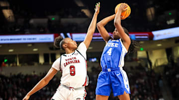 Dec 5, 2024; Columbia, South Carolina, USA; Duke Blue Devils guard Jadyn Donovan (4) shoots over South Carolina Gamecocks forward Joyce Edwards (8) in the second half at Colonial Life Arena. Mandatory Credit: Jeff Blake-Imagn Images