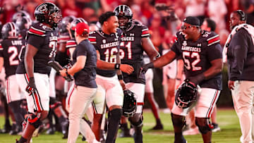 Sep 27, 2025; Columbia, South Carolina, USA; South Carolina Gamecocks quarterback LaNorris Sellers (16) and offensive lineman Nick Sharpe (52) celebrate a defensive touchdown against the Kentucky Wildcats in the second quarter at Williams-Brice Stadium. Mandatory Credit: Jeff Blake-Imagn Images