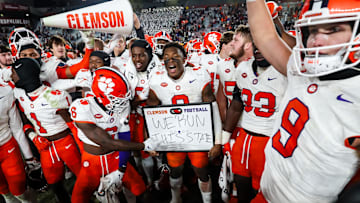 Nov 25, 2023; Columbia, South Carolina, USA; Clemson Tigers linebacker Barrett Carter (0) holds a  We Run this state  sign after defeating the South Carolina Gamecocks at Williams-Brice Stadium. Mandatory Credit: Jeff Blake-Imagn Images
