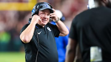 Sep 27, 2025; Columbia, South Carolina, USA; Kentucky Wildcats head coach Mark Stoops celebrates a touchdown against the South Carolina Gamecocks in the first quarter at Williams-Brice Stadium. Mandatory Credit: Jeff Blake-Imagn Images