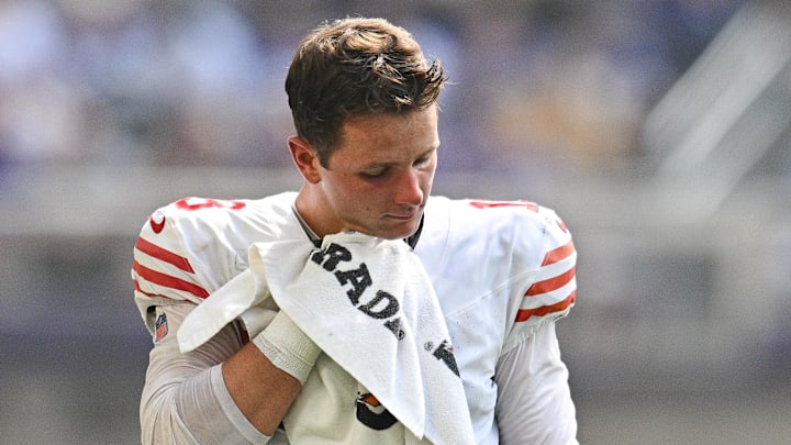 Sep 15, 2024; Minneapolis, Minnesota, USA; San Francisco 49ers quarterback Brock Purdy (13) wipes off with a towel during a timeout during the second quarter against the Minnesota Vikings U.S. Bank Stadium. Mandatory Credit: Jeffrey Becker-Imagn Images