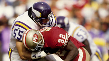 Minnesota Vikings linebacker Jack Del Rio (55) knocks the ball loose from San Francisco 49ers running back Ricky Watters (32)