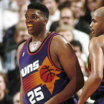 Phoenix Suns forward Charles Barkley (34) talks to Oliver Miller against the Portland Trail Blazers at Memorial Coliseum in Portland (undated file photo 1992). 