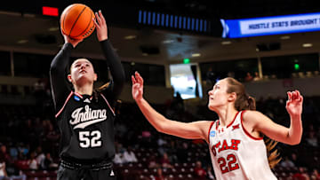 Mar 21, 2025; Columbia, South Carolina, USA; Indiana Hoosiers forward Lilly Meister (52) shoots over Utah Utes forward Jenna Johnson (22) in the first half at Colonial Life Arena. Mandatory Credit: Jeff Blake-Imagn Images