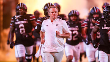 Sep 27, 2025; Columbia, South Carolina, USA; South Carolina Gamecocks head coach Shane Beamer leads his team onto the field during the Gamecocks 2001 entrance before their game against the Kentucky Wildcats at Williams-Brice Stadium. Mandatory Credit: Jeff Blake-Imagn Images