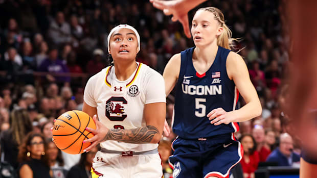 South Carolina Gamecocks guard Te-Hina Paopao (0) drives past UConn Huskies guard Paige Bueckers (5) in the first half