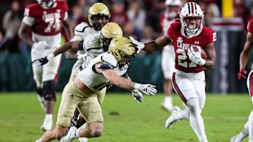 Nov 23, 2024; Columbia, South Carolina, USA; South Carolina Gamecocks running back Oscar Adaway III (27) runs the ball against the Wofford Terriers in the second half at Williams-Brice Stadium. Mandatory Credit: Jeff Blake-Imagn Images