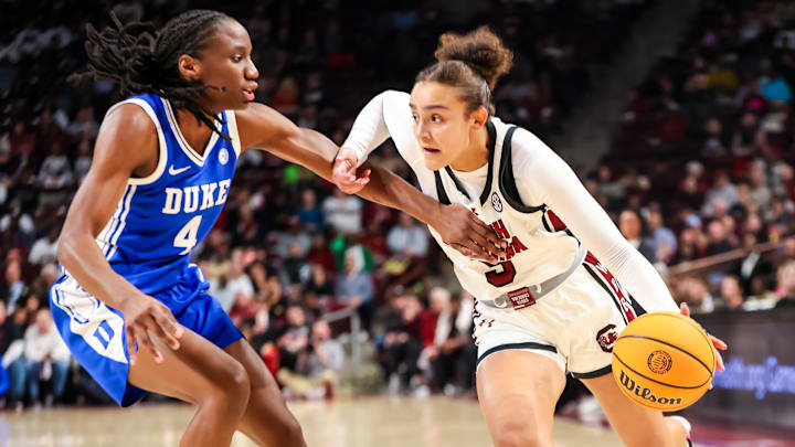 Dec 5, 2024; Columbia, South Carolina, USA; South Carolina Gamecocks guard Tessa Johnson (5) drives past Duke Blue Devils guard Jadyn Donovan (4) in the first half at Colonial Life Arena. Mandatory Credit: Jeff Blake-Imagn Images