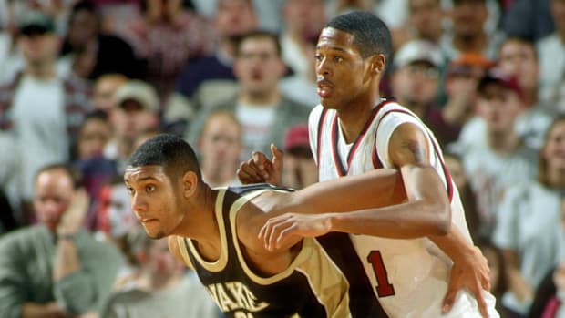 Wake Forest Demon Deacons center (21) Tim Duncan posts up against Massachusetts Minutemen center (21) Marcus Camby.