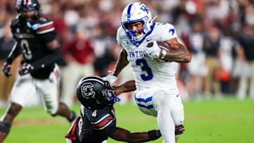 Sep 27, 2025; Columbia, South Carolina, USA; Kentucky Wildcats running back Seth McGowan (3) gets past South Carolina Gamecocks defensive back Vicari Swain (4) on his way to a touchdown in the first quarter at Williams-Brice Stadium. Mandatory Credit: Jeff Blake-Imagn Images