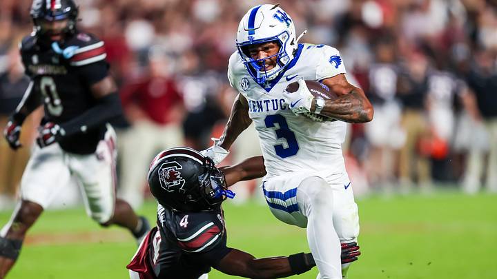 Sep 27, 2025; Columbia, South Carolina, USA; Kentucky Wildcats running back Seth McGowan (3) gets past South Carolina Gamecocks defensive back Vicari Swain (4) on his way to a touchdown in the first quarter at Williams-Brice Stadium. Mandatory Credit: Jeff Blake-Imagn Images