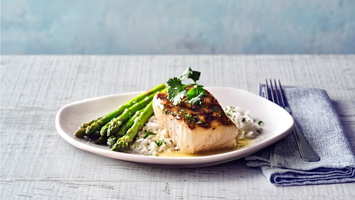 Parker’s Margarita Sea Bass is wood-grilled with chef-crafted tequila lime sauce, with jasmine rice and asparagus