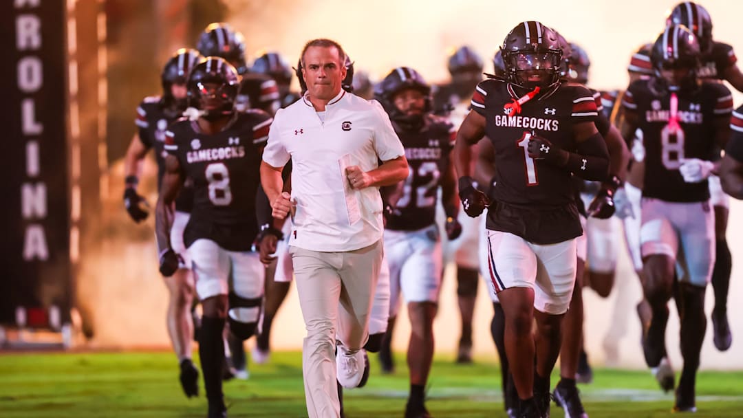 Sep 27, 2025; Columbia, South Carolina, USA; South Carolina Gamecocks head coach Shane Beamer leads his team onto the field during the Gamecocks 2001 entrance before their game against the Kentucky Wildcats at Williams-Brice Stadium. Mandatory Credit: Jeff Blake-Imagn Images Sep 27, 2025; Columbia, South Carolina, USA; South Carolina Gamecocks head coach Shane Beamer leads his team onto the field during the Gamecocks 2001 entrance before their game against the Kentucky Wildcats at Williams-Brice Stadium. Mandatory Credit: Jeff Blake-Imagn Images