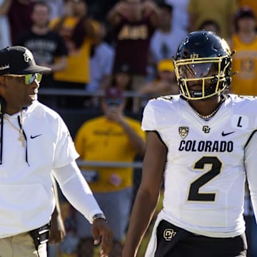 Colorado Buffaloes head coach Deion Sanders with son and quarterback Shedeur Sanders.