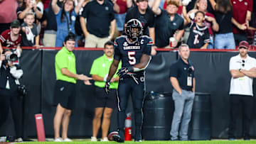 Nov 2, 2024; Columbia, South Carolina, USA; South Carolina Gamecocks running back Raheim Sanders (5) celebrates a touchdown against the Texas A&M Aggies in the fourth quarter at Williams-Brice Stadium. Mandatory Credit: Jeff Blake-Imagn Images