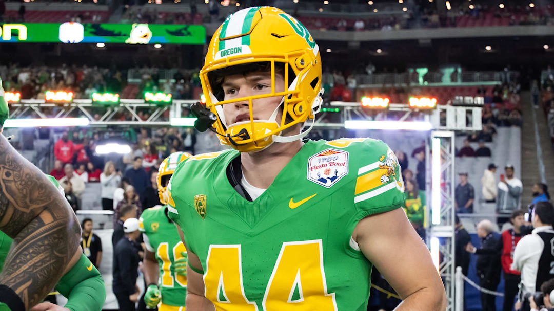 Jan 1, 2024; Glendale, AZ, USA; Oregon Ducks tight end Zach Grace (44) against the Liberty Flames during the 2024 Fiesta Bowl at State Farm Stadium. Mandatory Credit: Mark J. Rebilas-Imagn Images