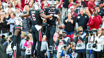 Nov 16, 2024; Columbia, South Carolina, USA; South Carolina Gamecocks wide receiver Nyck Harbor (8) celebrates a 26-yard touchdown reception with tight end Joshua Simon (6) against the Missouri Tigers in the first quarter at Williams-Brice Stadium. Mandatory Credit: Jeff Blake-Imagn Images